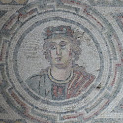 A mosaic head of a Roman