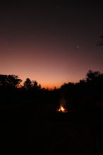 camp fire with evening star